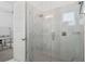 Large walk-in shower with marble tile and glass enclosure at 1529 Corolla Ct, Reunion, FL 34747