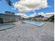 Community pool and spa with patio and lounge chairs at 3053 George Mason Ave # D, Winter Park, FL 32792