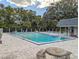 Community pool with lounge chairs and seating area at 3053 George Mason Ave # D, Winter Park, FL 32792