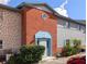 Brick and stone exterior of a two-story building with a light blue door at 3053 George Mason Ave # D, Winter Park, FL 32792