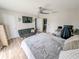 Comfortable bedroom with a queen bed, a sitting area and a view to the laundry area at 3053 George Mason Ave # D, Winter Park, FL 32792