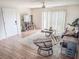 Living room with sliding glass doors, comfy seating, and hardwood floors at 3053 George Mason Ave # D, Winter Park, FL 32792