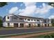 Row of townhouses with gray and white siding, attached garages at 4620 Campsite Loop, Orlando, FL 32824