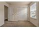 Bright bedroom with double doors and closet at 4763 Creekside Park Ave, Orlando, FL 32811