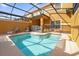 Private screened pool with lounge chairs at 8962 Cuban Palm Rd, Kissimmee, FL 34747