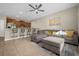 Open floor plan with kitchen, living room, and breakfast bar at 8962 Cuban Palm Rd, Kissimmee, FL 34747