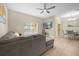 Living room with sectional sofa and ceiling fan at 8962 Cuban Palm Rd, Kissimmee, FL 34747