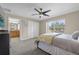 Main bedroom with ceiling fan and large window at 8962 Cuban Palm Rd, Kissimmee, FL 34747