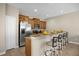 Modern kitchen features granite countertops and wood cabinets at 8962 Cuban Palm Rd, Kissimmee, FL 34747