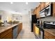 Modern kitchen with granite countertops and stainless steel appliances at 8962 Cuban Palm Rd, Kissimmee, FL 34747