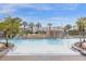 Inviting community pool with a rock waterfall and plenty of space for lounging at 8962 Cuban Palm Rd, Kissimmee, FL 34747