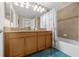 Bathroom with double vanity and bathtub at 8962 Cuban Palm Rd, Kissimmee, FL 34747