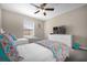Bedroom with two twin beds, a TV and playful decor at 8962 Cuban Palm Rd, Kissimmee, FL 34747