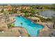 Relaxing pool area with a large freeform pool and a waterslide at 8962 Cuban Palm Rd, Kissimmee, FL 34747
