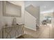 Bright entryway with gold console table and mirror at 8962 Cuban Palm Rd, Kissimmee, FL 34747