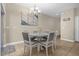 Dining area with round table and gray chairs at 8962 Cuban Palm Rd, Kissimmee, FL 34747