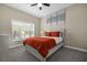 Bright bedroom with double bed and window coverings at 8962 Cuban Palm Rd, Kissimmee, FL 34747