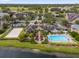 Aerial view of community with pool and lake at 14304 Fredricksburg Dr # 420, Orlando, FL 32837