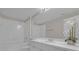 Clean bathroom with white vanity and bathtub at 14304 Fredricksburg Dr # 420, Orlando, FL 32837