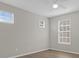 Bright bedroom with wood-look floors and multiple windows at 14304 Fredricksburg Dr # 420, Orlando, FL 32837