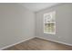Well-lit bedroom with wood-look floors at 14304 Fredricksburg Dr # 420, Orlando, FL 32837