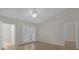 Spacious bedroom with wood-look floors and access to balcony at 14304 Fredricksburg Dr # 420, Orlando, FL 32837