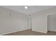 Spacious bedroom with neutral walls and wood-look floors at 14304 Fredricksburg Dr # 420, Orlando, FL 32837
