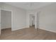 Bedroom with wood-look floors and access to hallway at 14304 Fredricksburg Dr # 420, Orlando, FL 32837