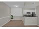 Modern kitchen with white cabinets, black countertops, and stainless steel appliances at 14304 Fredricksburg Dr # 420, Orlando, FL 32837