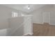 Open living room with high ceilings, wood floors, and access to a balcony at 14304 Fredricksburg Dr # 420, Orlando, FL 32837