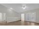 Spacious living room with high ceilings, wood floors, and balcony access at 14304 Fredricksburg Dr # 420, Orlando, FL 32837