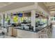 Poolside bar with seating and a modern design at 14501 Grove Resort Ave # 1332, Winter Garden, FL 34787