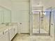 Bathroom with double vanity,tiled shower, and separate toilet area at 1652 Cross Prairie Pkwy, Kissimmee, FL 34744