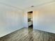 Spacious living room with wood-look floors and access to backyard at 1652 Cross Prairie Pkwy, Kissimmee, FL 34744