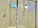 Clean shower with light beige tile and built-in shelves at 1652 Cross Prairie Pkwy, Kissimmee, FL 34744