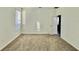 Bright bedroom with neutral walls and carpet, plus a window at 1652 Cross Prairie Pkwy, Kissimmee, FL 34744