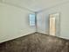 Bright bedroom with window and access to bathroom at 1652 Cross Prairie Pkwy, Kissimmee, FL 34744