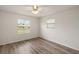 Bright bedroom with wood-look floors and large window at 2788 Privada Dr, The Villages, FL 32162
