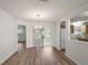 Dining area with wood-look floors and sliding glass doors at 2788 Privada Dr, The Villages, FL 32162