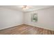 Bright bedroom features ceiling fan and vinyl flooring at 2788 Privada Dr, The Villages, FL 32162