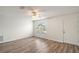 Living room with wood-look floors, window, and ceiling fan at 2788 Privada Dr, The Villages, FL 32162