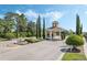 Gated community entrance with guard house and landscaping at 2871 Sandy Cay St, Clermont, FL 34711