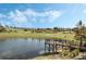 Serene lake with a wooden viewing deck at 2871 Sandy Cay St, Clermont, FL 34711