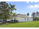 One-story house with a large backyard and palm trees at 2871 Sandy Cay St, Clermont, FL 34711
