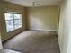 Empty dining room with large window and chandelier at 3001 Mandolin Dr, Kissimmee, FL 34744