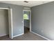 Bedroom with gray walls, carpet, and a closet at 3001 Mandolin Dr, Kissimmee, FL 34744