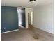 Empty bedroom with blue walls and carpeted floor at 3001 Mandolin Dr, Kissimmee, FL 34744