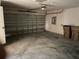Empty garage with concrete floor and overhead door at 3001 Mandolin Dr, Kissimmee, FL 34744