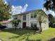 Two-story house with attached garage and landscaping at 3001 Mandolin Dr, Kissimmee, FL 34744