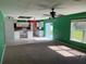 Open concept living room and kitchen with green walls at 3001 Mandolin Dr, Kissimmee, FL 34744